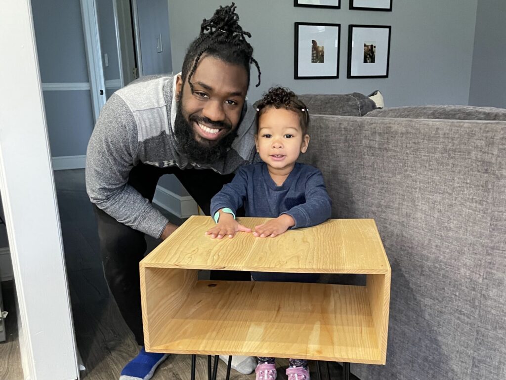 Me with my daughter and a side table i built.